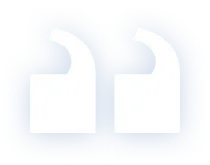A pair of white, stylized quotation marks on a blue background. The marks are depicted as two large, rounded shapes positioned side by side. The edges are slightly blurred, giving the image a soft, artistic appearance.